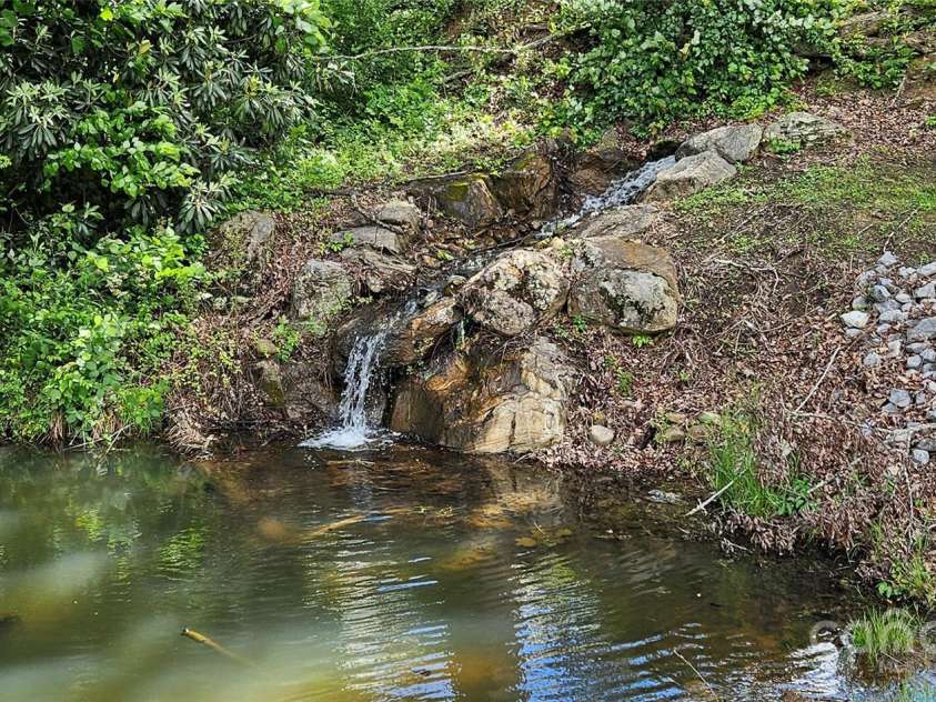 29 Farm Pond Lane, Candler, NC 28715.  MLS# CAR4258742, YatesRealty ID 31766. Stocked community pond