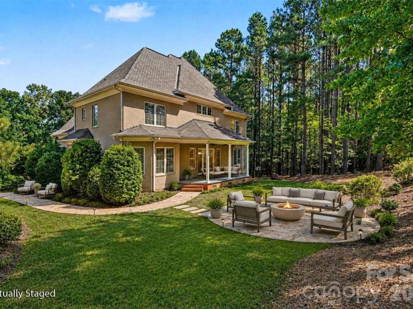 5129 Watermead Lane, Belmont, NC 28012.  MLS# CAR4384748, YatesRealty ID 31767. Backyard view with digitally staged fireplace