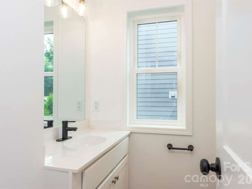 6 Berry Crest Lane, Arden, NC 28704.  MLS# CAR4391347, YatesRealty ID 31768. Half bath off the kitchen