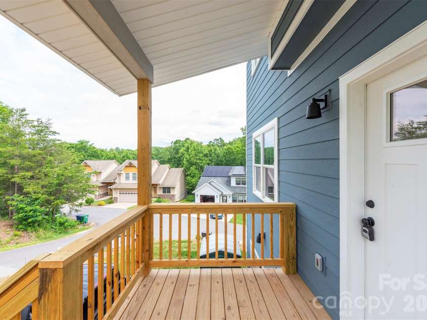 6 Berry Crest Lane, Arden, NC 28704.  MLS# CAR4391347, YatesRealty ID 31768. Large front porch