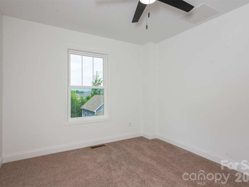 6 Berry Crest Lane, Arden, NC 28704.  MLS# CAR4391347, YatesRealty ID 31768. Second bedroom with mountain views