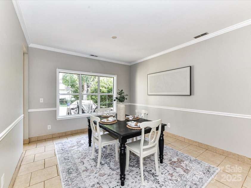 9029 Torrence Crossing Drive, Huntersville, NC 28078.  MLS# CAR4275401, YatesRealty ID 31784. Formal Dining with crown molding & tile floors!