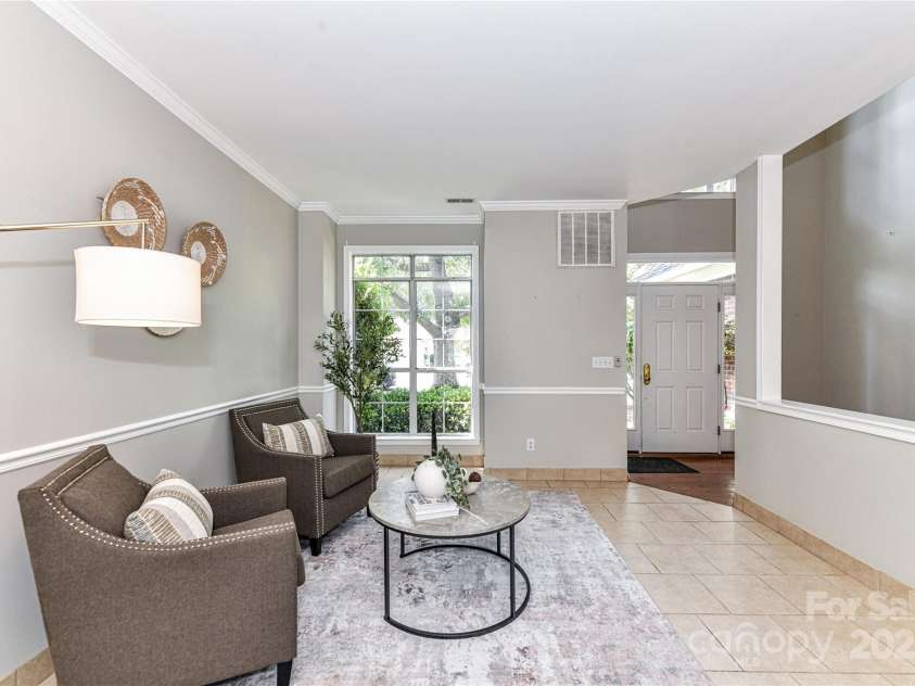9029 Torrence Crossing Drive, Huntersville, NC 28078.  MLS# CAR4275401, YatesRealty ID 31784. Formal Living Room with tile floors & crown molding!