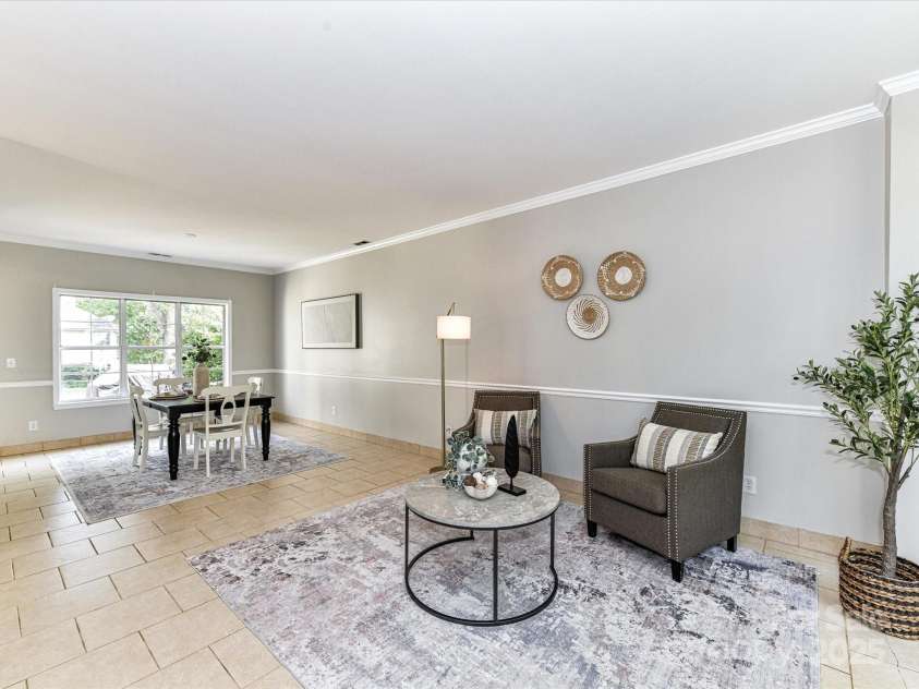 9029 Torrence Crossing Drive, Huntersville, NC 28078.  MLS# CAR4275401, YatesRealty ID 31784. Formal Living/Dining Room with tile floors, crown molding & great natural light!