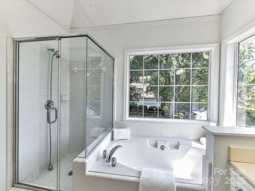 9029 Torrence Crossing Drive, Huntersville, NC 28078.  MLS# CAR4275401, YatesRealty ID 31784. Primary Bath features dual vanity, large garden tub with tile surround, separate shower & tile floors!