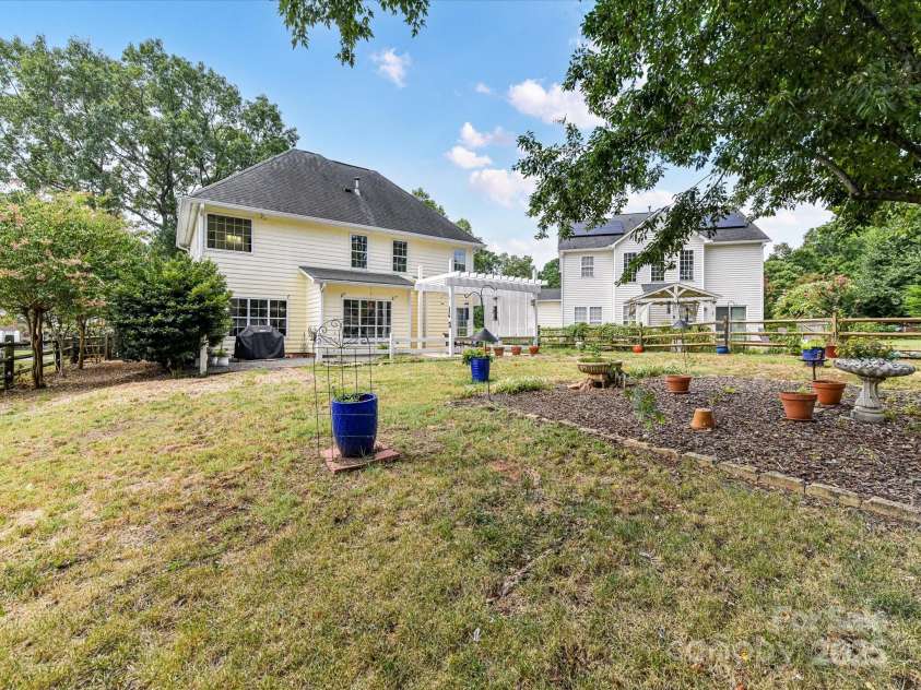 9029 Torrence Crossing Drive, Huntersville, NC 28078.  MLS# CAR4275401, YatesRealty ID 31784. So much space in this fenced, level back yard perfect for gardening or activities!