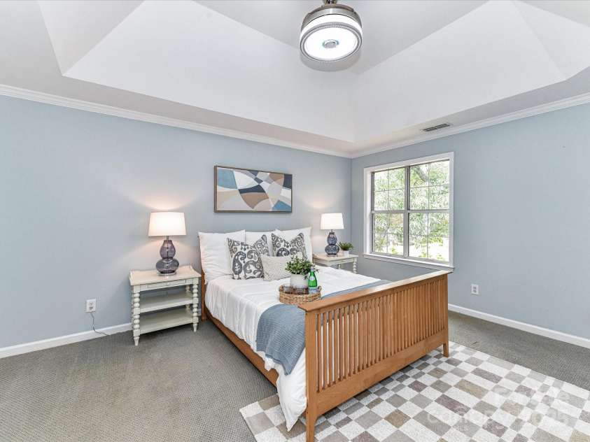 9029 Torrence Crossing Drive, Huntersville, NC 28078.  MLS# CAR4275401, YatesRealty ID 31784. Spacious Primary Bedroom on upper level with deep tray ceiling, walk in closet & private bath!