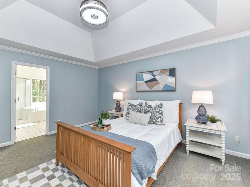 9029 Torrence Crossing Drive, Huntersville, NC 28078.  MLS# CAR4275401, YatesRealty ID 31784. Spacious Primary Bedroom on upper level with deep tray ceiling, walk in closet & private bath!