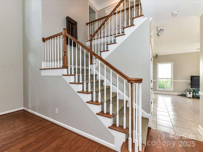 9029 Torrence Crossing Drive, Huntersville, NC 28078.  MLS# CAR4275401, YatesRealty ID 31784. Staircase to upper level!