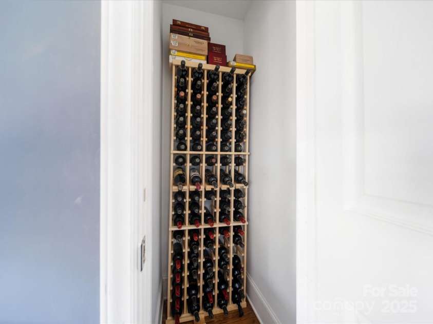 1623 Geneva Court, Charlotte, NC 28209.  MLS# CAR4235982, YatesRealty ID 3180. Built-in Wine rack in Den closet