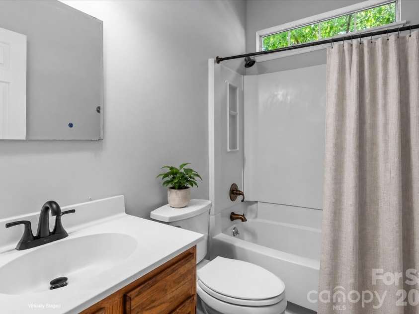 11823 Harris Ridge Drive, Charlotte, NC 28269.  MLS# CAR4370842, YatesRealty ID 31801. Hall Bathroom Virtually Staged