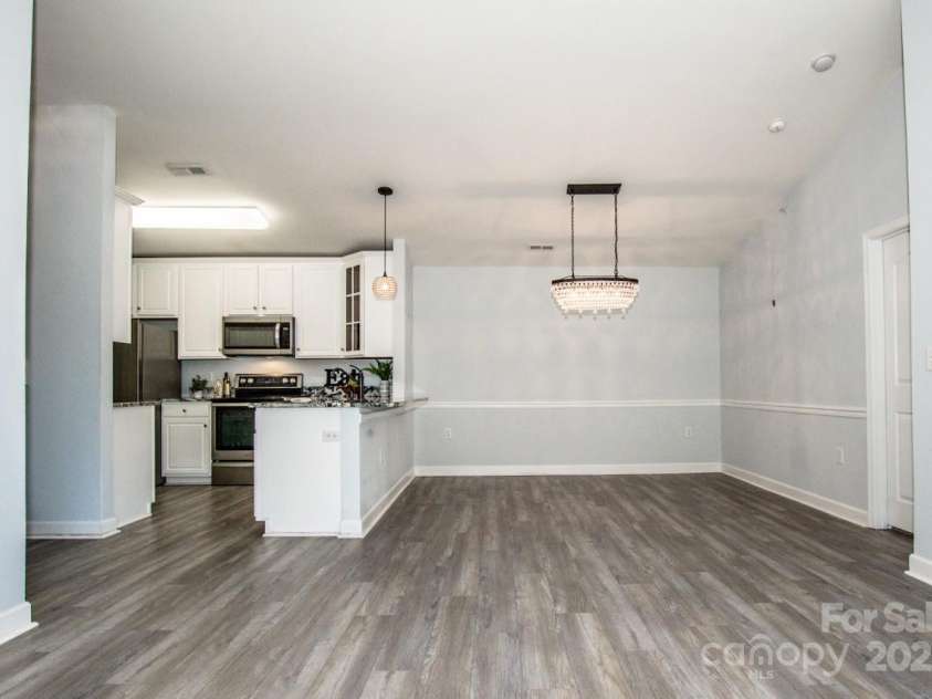 17151 Doe Valley Court, Cornelius, NC 28031.  MLS# CAR4286803, YatesRealty ID 31801. Designer-Style Lighting In The Dining Area