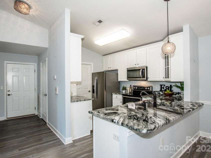17151 Doe Valley Court, Cornelius, NC 28031.  MLS# CAR4286803, YatesRealty ID 31801. Pristine-White Cabinets
