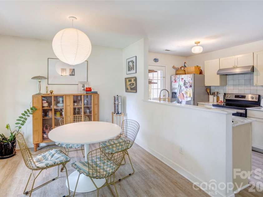 122 Crowell Drive, Concord, NC 28025.  MLS# CAR4388957, YatesRealty ID 31804. Dining area with a view into the kitchen