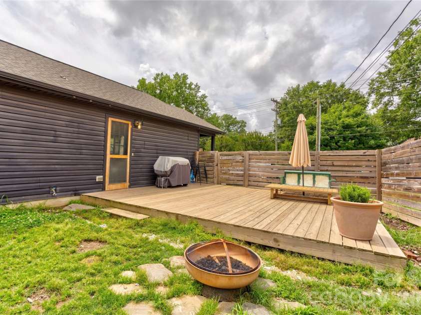 122 Crowell Drive, Concord, NC 28025.  MLS# CAR4388957, YatesRealty ID 31804. Private backyard with large back deck