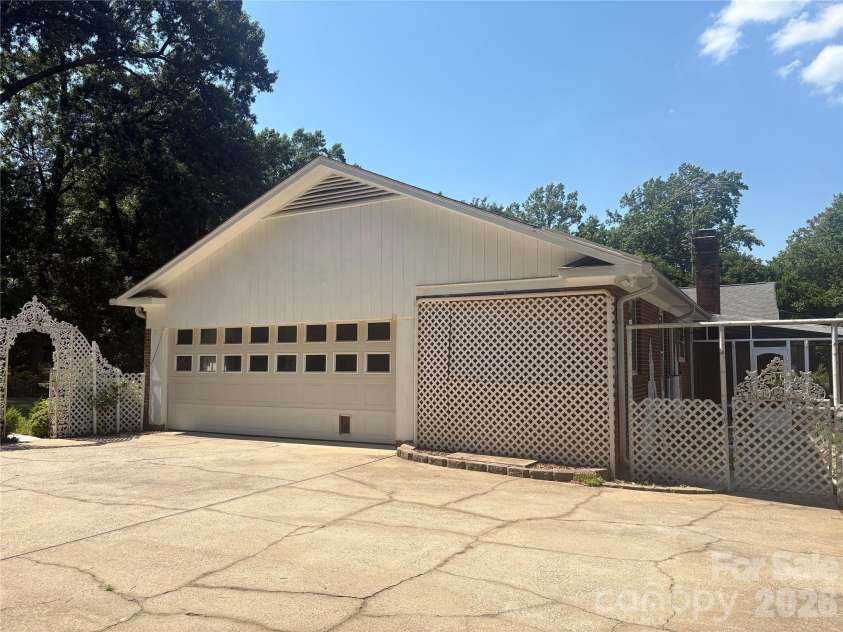 5500 Saddlewood Lane, Mint Hill, NC 28227.  MLS# CAR4382931, YatesRealty ID 31815. 2 car large side load garage with workshop!