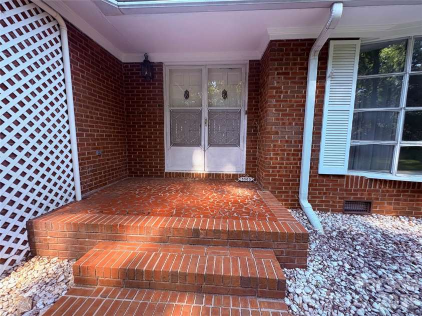 5500 Saddlewood Lane, Mint Hill, NC 28227.  MLS# CAR4382931, YatesRealty ID 31815. Beautiful broken tile and brick entrance.