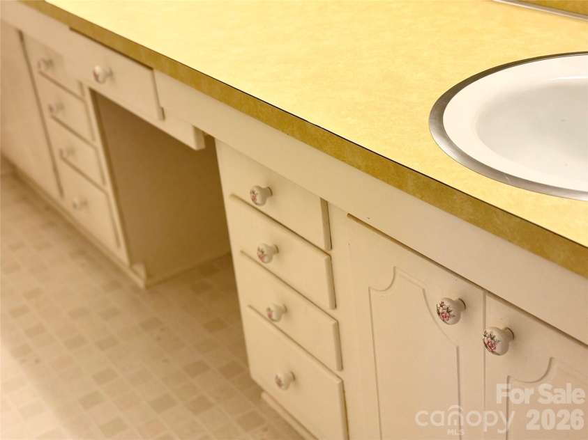 5500 Saddlewood Lane, Mint Hill, NC 28227.  MLS# CAR4382931, YatesRealty ID 31815. Pretty large vanity in hall full bath!