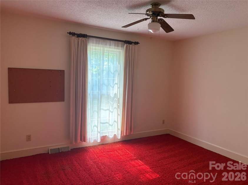 5500 Saddlewood Lane, Mint Hill, NC 28227.  MLS# CAR4382931, YatesRealty ID 31815. Pretty retro red shag!
