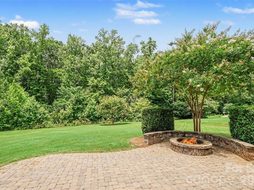 2521 Surveyor General Drive, Waxhaw, NC 28173.  MLS# CAR4426131, YatesRealty ID 31822. Paver patio with firepit and seating