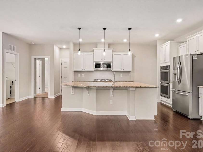 2521 Surveyor General Drive, Waxhaw, NC 28173.  MLS# CAR4426131, YatesRealty ID 31822. The kitchen features an expansive island