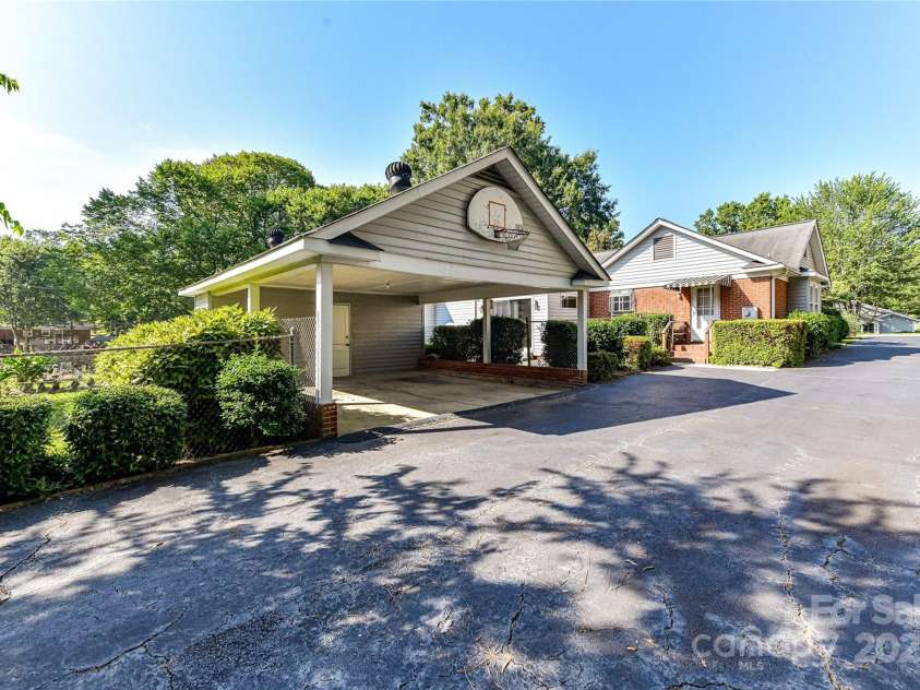 6811 Old Reid Road, Charlotte, NC 28210.  MLS# CAR4284933, YatesRealty ID 31822. 2 Car Carport with Storage Room