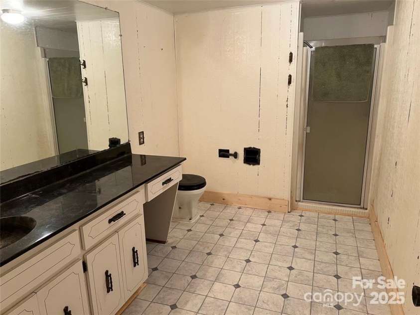 92 Mountain View Road, Burnsville, NC 28714.  MLS# CAR4278979, YatesRealty ID 31832. Basement bathroom