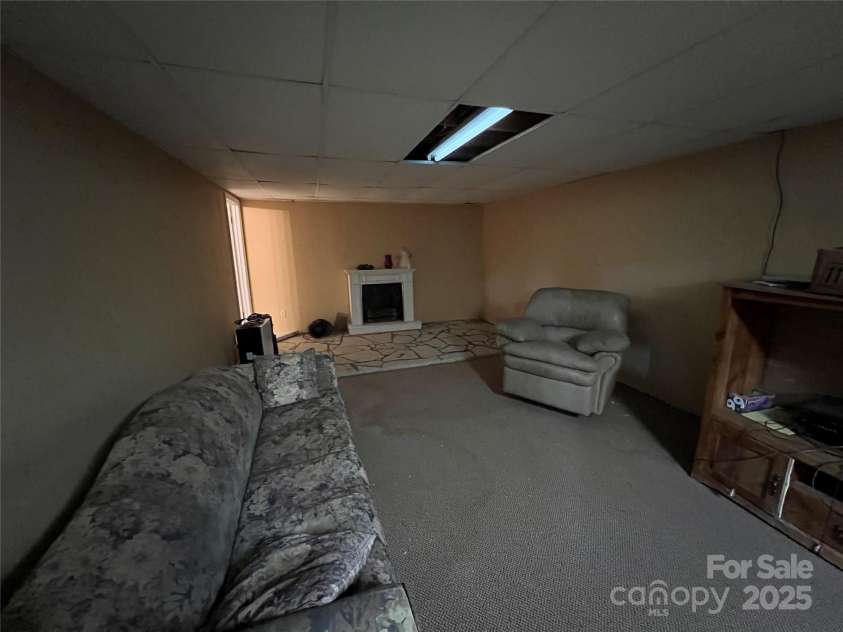 92 Mountain View Road, Burnsville, NC 28714.  MLS# CAR4278979, YatesRealty ID 31832. Finished basement w/gas fireplace