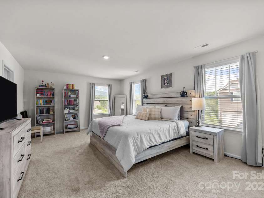 183 Marathon Lane, Candler, NC 28715.  MLS# CAR4284334, YatesRealty ID 31833. Large primary bedroom with lots of windows.