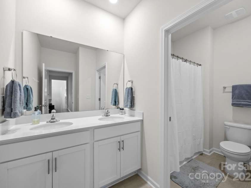 183 Marathon Lane, Candler, NC 28715.  MLS# CAR4284334, YatesRealty ID 31833. Lower level full bathroom.