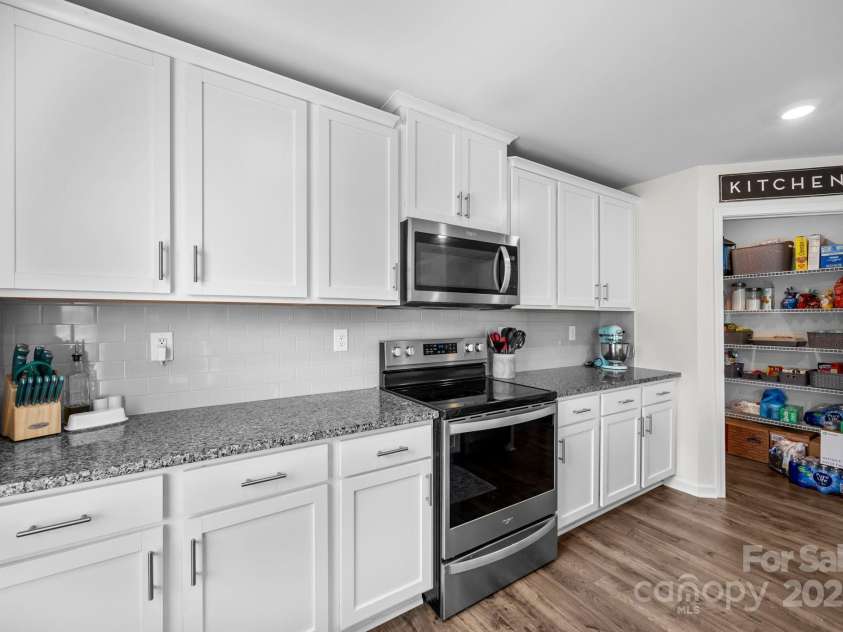 183 Marathon Lane, Candler, NC 28715.  MLS# CAR4284334, YatesRealty ID 31833. Stainless steel appliances and walk-in panty.