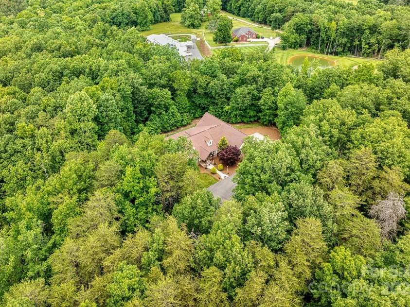 560 Blue Sky Drive, Dallas, NC 28034.  MLS# CAR4262735, YatesRealty ID 31836. Situated on over 4.3 private wooded acres