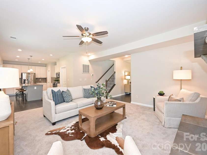 3729 Benseval Lane, Matthews, NC 28105.  MLS# CAR4382542, YatesRealty ID 31842. Great Room flows into the Kitchen