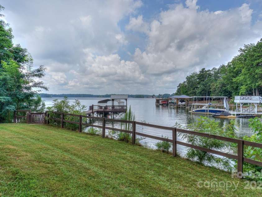 136 Buttercup Drive, Mooresville, NC 28117.  MLS# CAR4284193, YatesRealty ID 31853. Back yard water views.