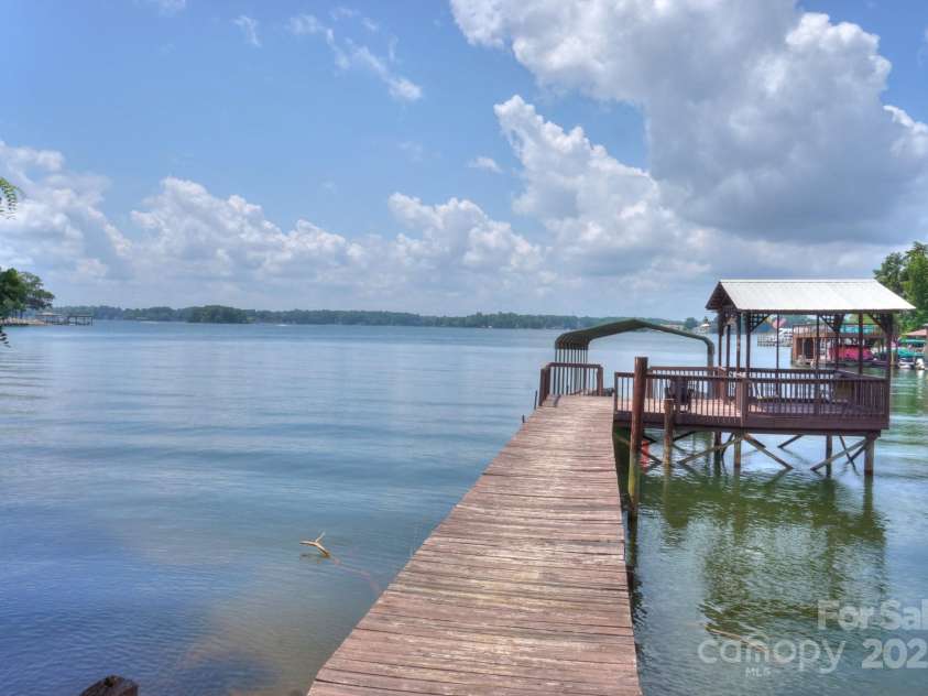 136 Buttercup Drive, Mooresville, NC 28117.  MLS# CAR4284193, YatesRealty ID 31853. Enjoy entertaining on this large dock/pier and have easy access to main channel