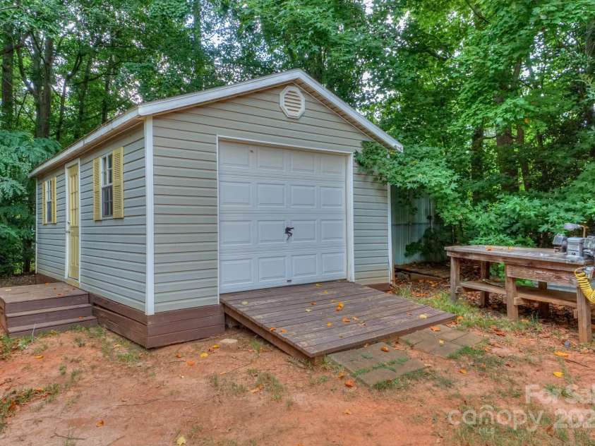 136 Buttercup Drive, Mooresville, NC 28117.  MLS# CAR4284193, YatesRealty ID 31853. Garage with access door and ramp.