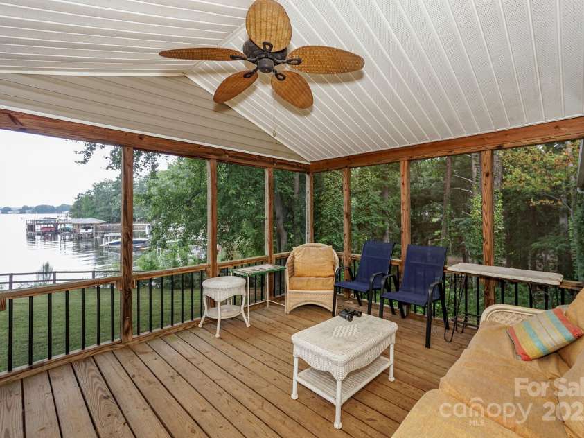136 Buttercup Drive, Mooresville, NC 28117.  MLS# CAR4284193, YatesRealty ID 31853. Imagine sitting in the covered back screened porch with morning coffee or evening sunsets.