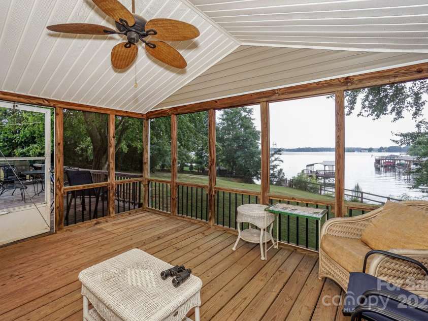 136 Buttercup Drive, Mooresville, NC 28117.  MLS# CAR4284193, YatesRealty ID 31853. Lots of outdoor living space while looking at the lake.