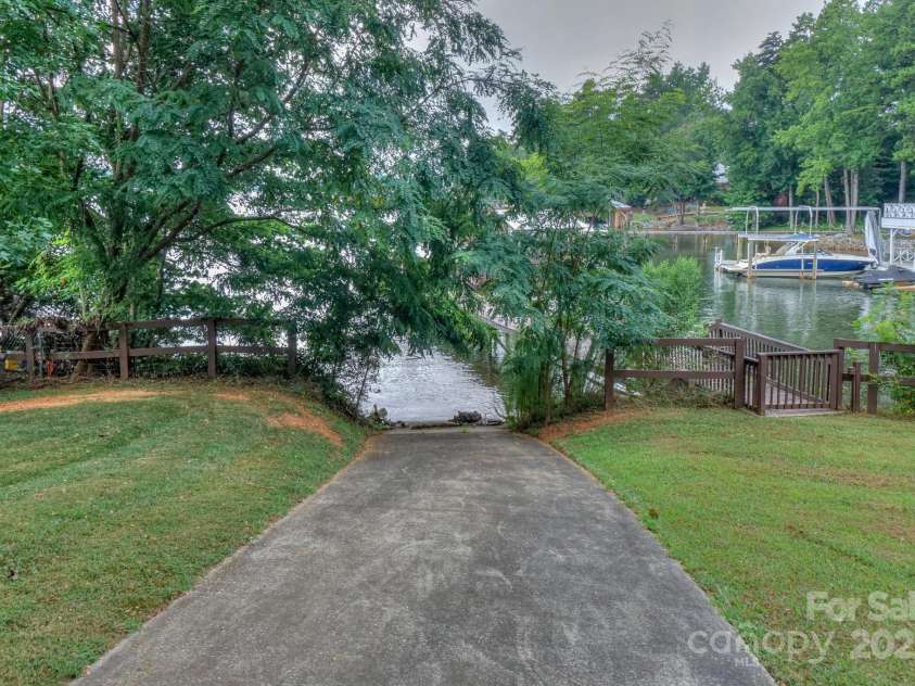 136 Buttercup Drive, Mooresville, NC 28117.  MLS# CAR4284193, YatesRealty ID 31853. Private boat ramp is great for walking in your paddleboard or launching your own jet ski or boat.