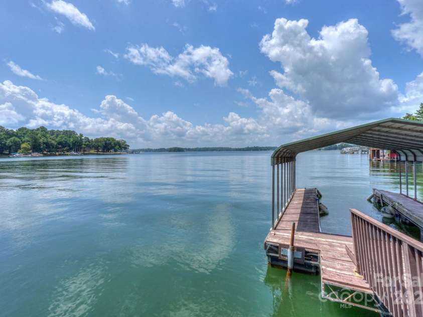 136 Buttercup Drive, Mooresville, NC 28117.  MLS# CAR4284193, YatesRealty ID 31853. Protect your boat with the covered boat dock area or launch your paddleboard or kayak from your own dock.