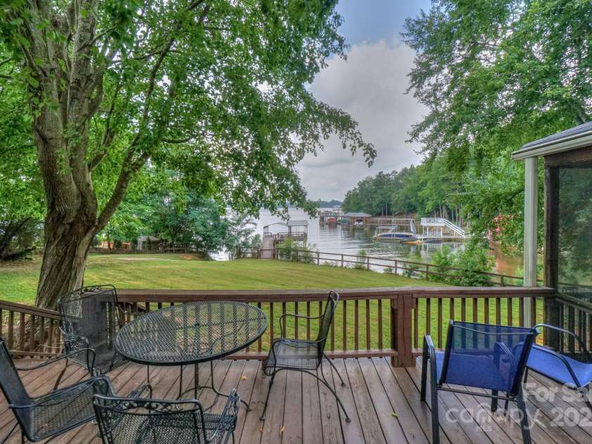 136 Buttercup Drive, Mooresville, NC 28117.  MLS# CAR4284193, YatesRealty ID 31853. Stunning views from the backyard deck