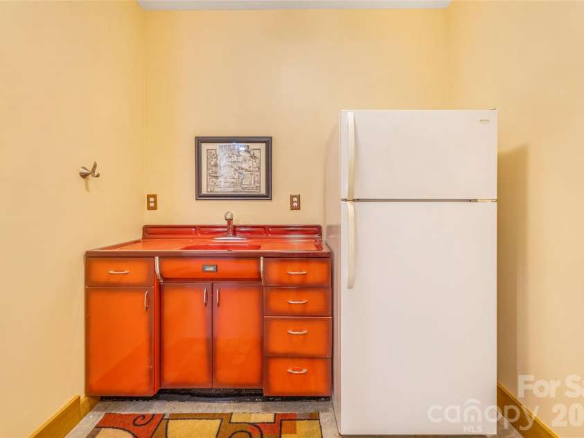 446 Amanda Drive, Mars Hill, NC 28754.  MLS# CAR4368422, YatesRealty ID 31853. Downstairs sink & refrigerator.