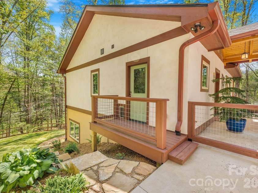 446 Amanda Drive, Mars Hill, NC 28754.  MLS# CAR4368422, YatesRealty ID 31853. Side entry to mud room and steps down to lower level yard