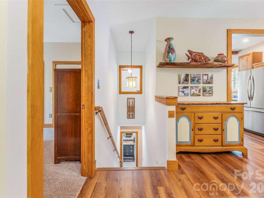 446 Amanda Drive, Mars Hill, NC 28754.  MLS# CAR4368422, YatesRealty ID 31853. Stairs to the lower level.