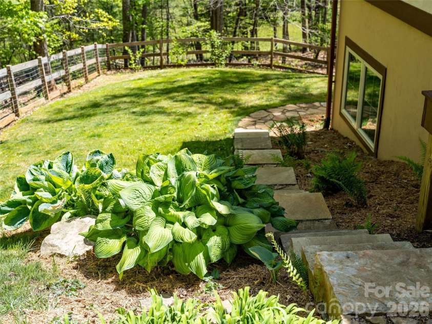 446 Amanda Drive, Mars Hill, NC 28754.  MLS# CAR4368422, YatesRealty ID 31853. Stone steps to back yard area