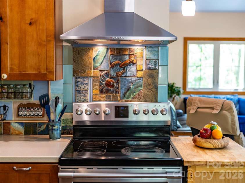 446 Amanda Drive, Mars Hill, NC 28754.  MLS# CAR4368422, YatesRealty ID 31853. This home has many bespoke features, like this handcrafted tile backsplash.