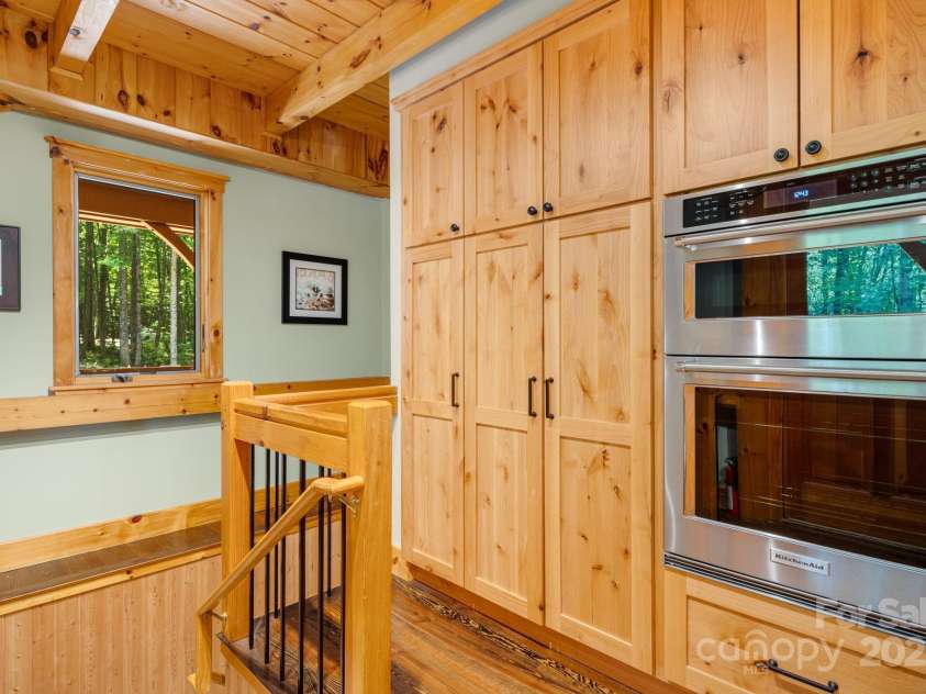 492 Henry Mountain Road, Brevard, NC 28712.  MLS# CAR4278583, YatesRealty ID 31855. Additional storage and double ovens.