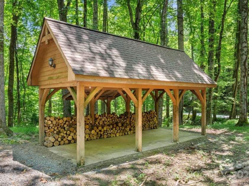 492 Henry Mountain Road, Brevard, NC 28712.  MLS# CAR4278583, YatesRealty ID 31855. An outbuilding that could cover a car, boat, tractor, or just firewood. Maybe, a picnic table.