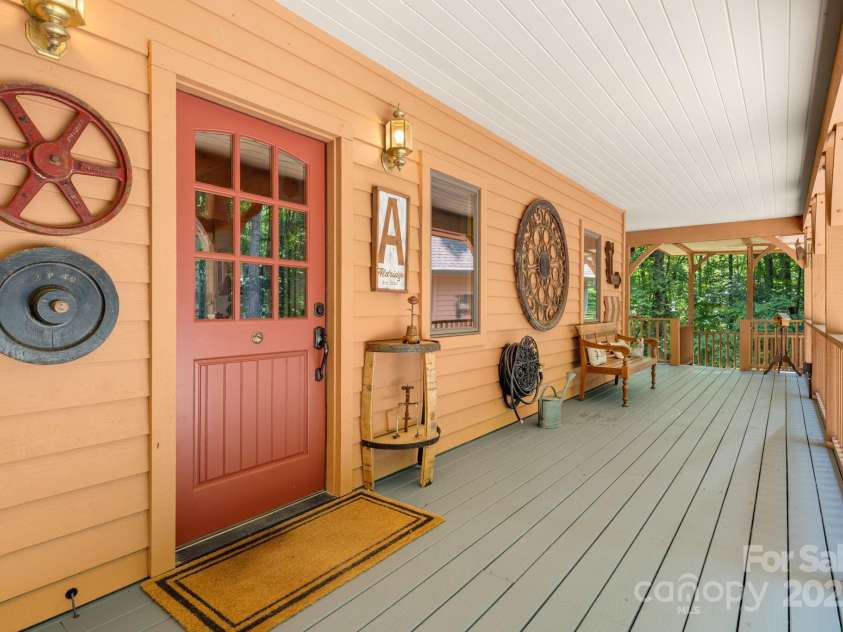 492 Henry Mountain Road, Brevard, NC 28712.  MLS# CAR4278583, YatesRealty ID 31855. Front porch and view to the right.