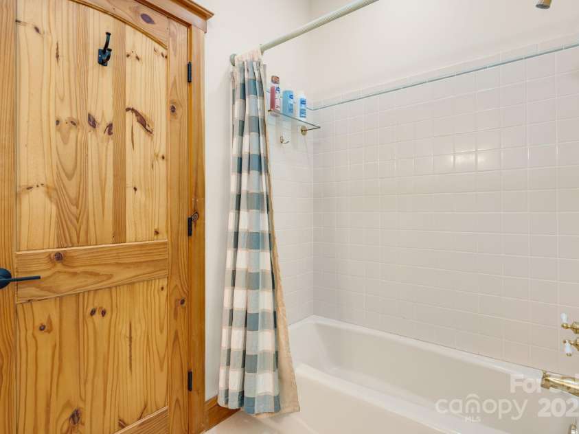 492 Henry Mountain Road, Brevard, NC 28712.  MLS# CAR4278583, YatesRealty ID 31855. Guest bath 1 shower.  Both upstairs showers are the same.